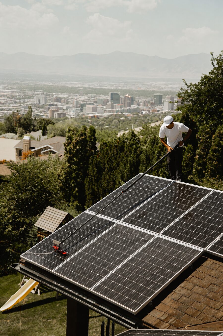 Sterling Home Services technician cleaning solar panels